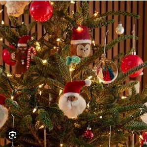 West Elm multi racial Santa wool ornaments